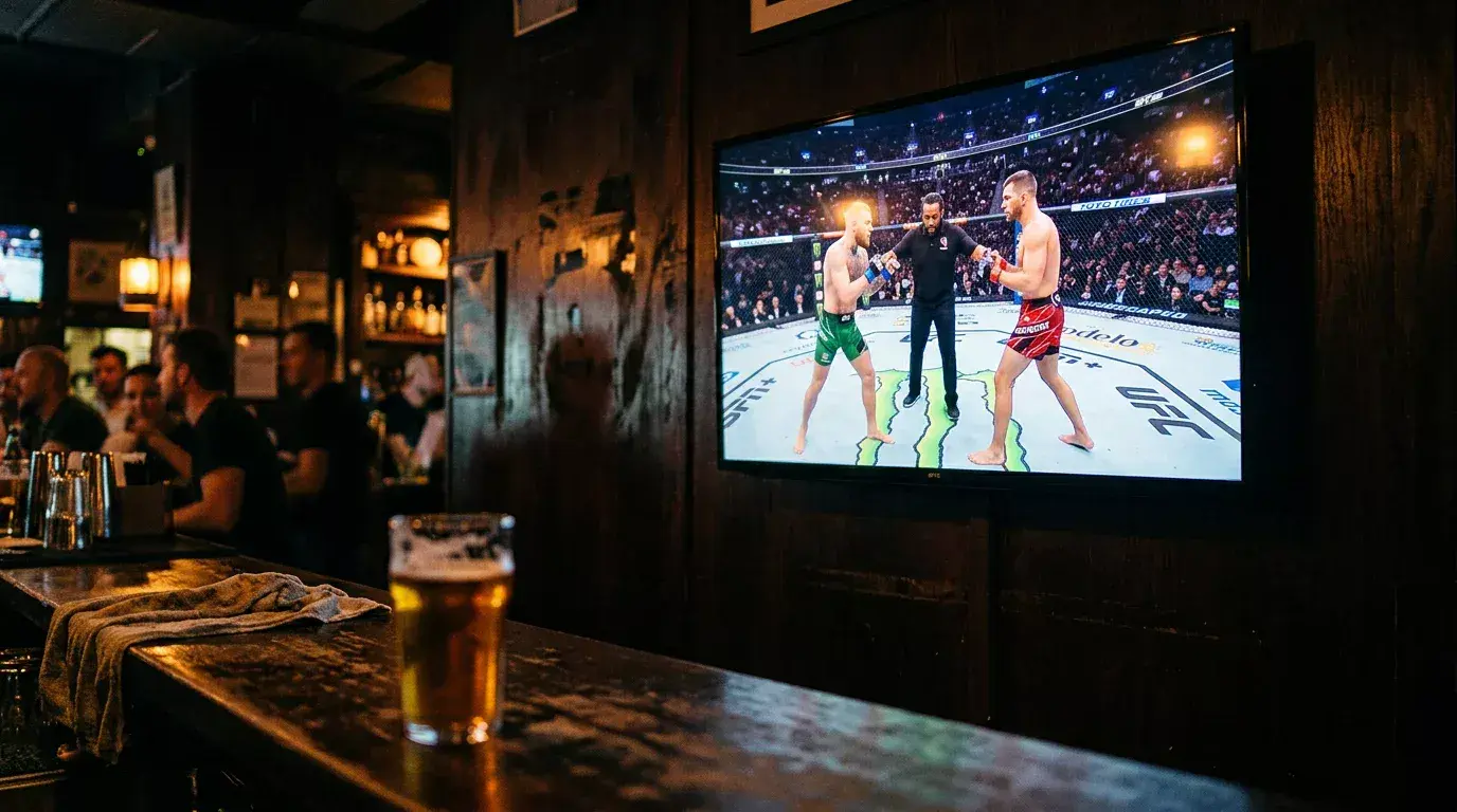 Close-up of a UFC octagon with betting odds overlay on a sportsbook screen during fight night